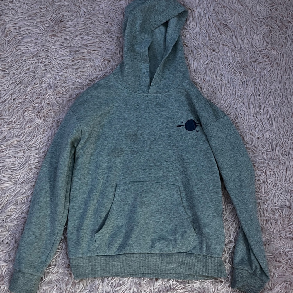 Gray hoodie with pocket, mini Saturn print on front, large on back.